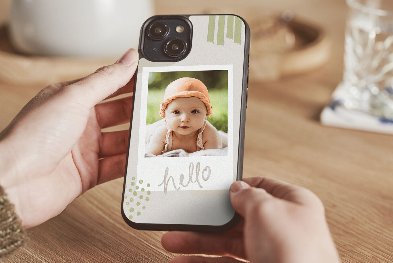 A phone showcasing a personalized photo. The photo is framed and features a cheerful font.