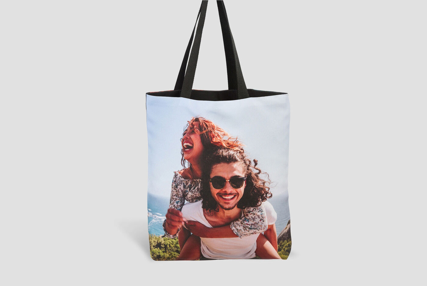 A stylish bag with a beautiful photo motif of two happy people enjoying a day outdoors together.