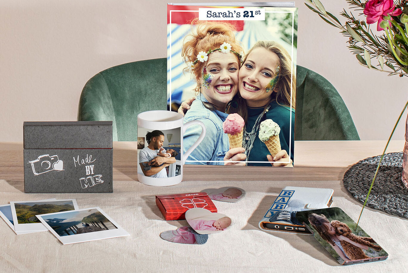 Table with personalized gifts and a photo poster celebrating the 21st birthday