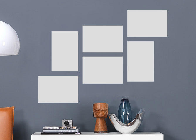 Simple wall with empty picture frames for creative design