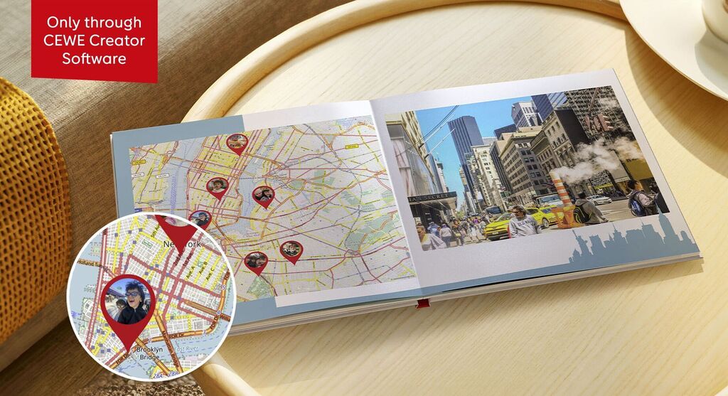 A CEWE photo book on a table with a city map and a photo of friends.