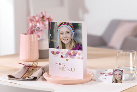 Elegant table decoration with menu card and flower vase