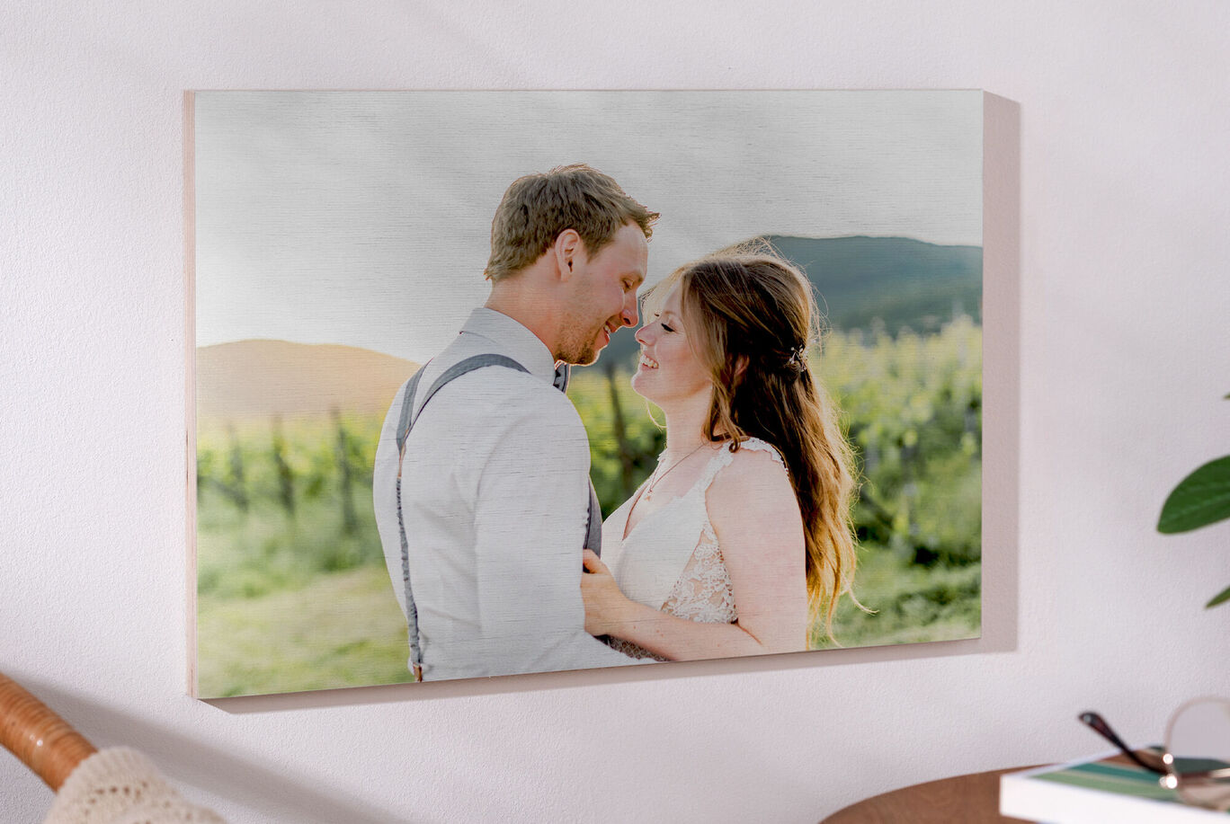 A romantic couple embracing in a picturesque vineyard landscape.