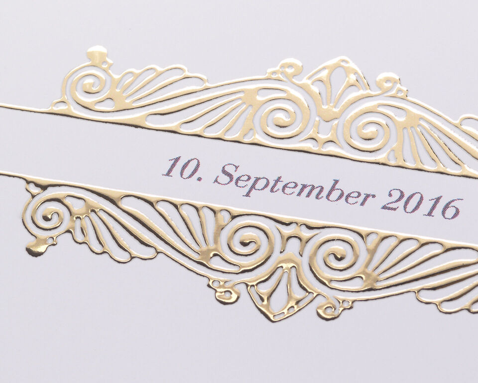 A decorative gold frame around a date.
