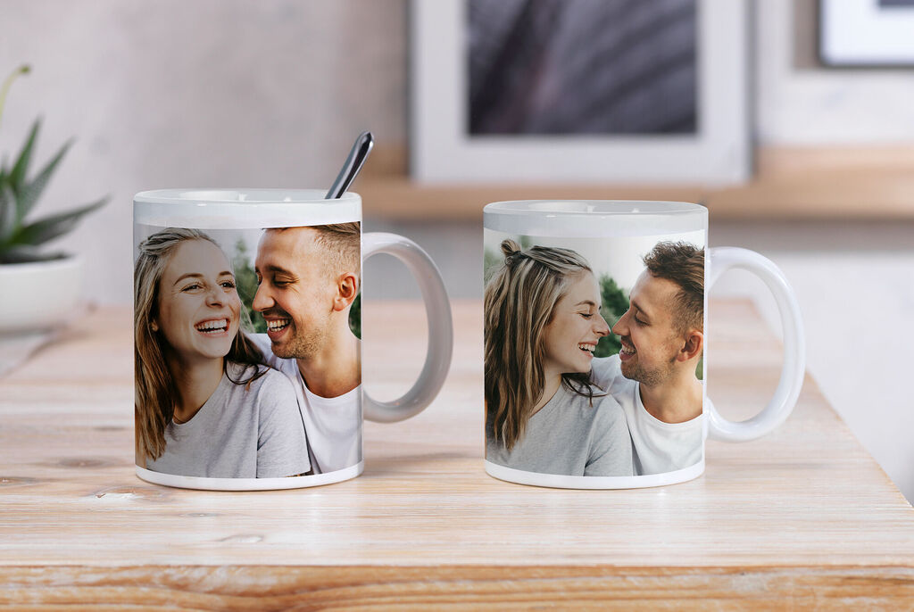 Two personalized mugs with photo prints of happy people