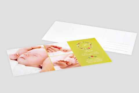 A personalized CEWE greeting card shows a cute baby sleeping in its parents' arms, decorated with colorful flowers.