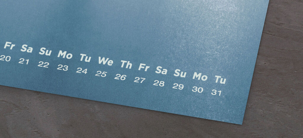 Calendar page with weekdays and numbers on a blue background.