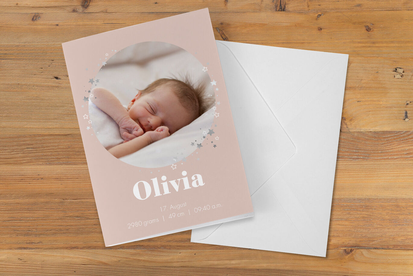 A lovingly designed baby postcard in soft colors.