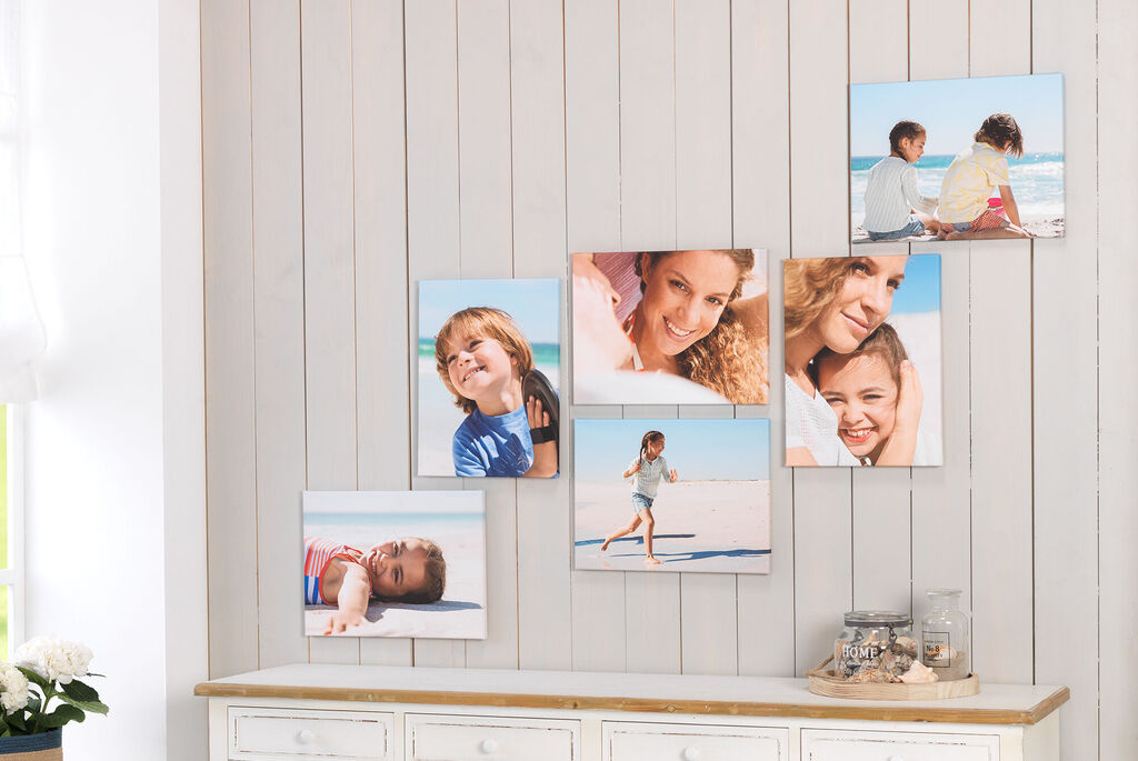 Wall pictures show happy moments at the beach with children.