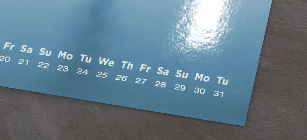 A blue calendar displays the days and weeks of the month.