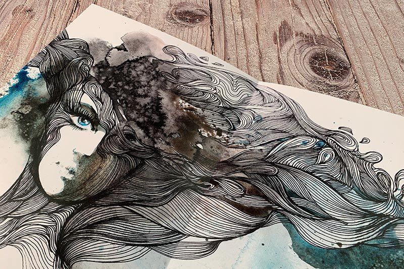 Creative image of a woman with flowing, graphic hair strands in blue and gray tones.