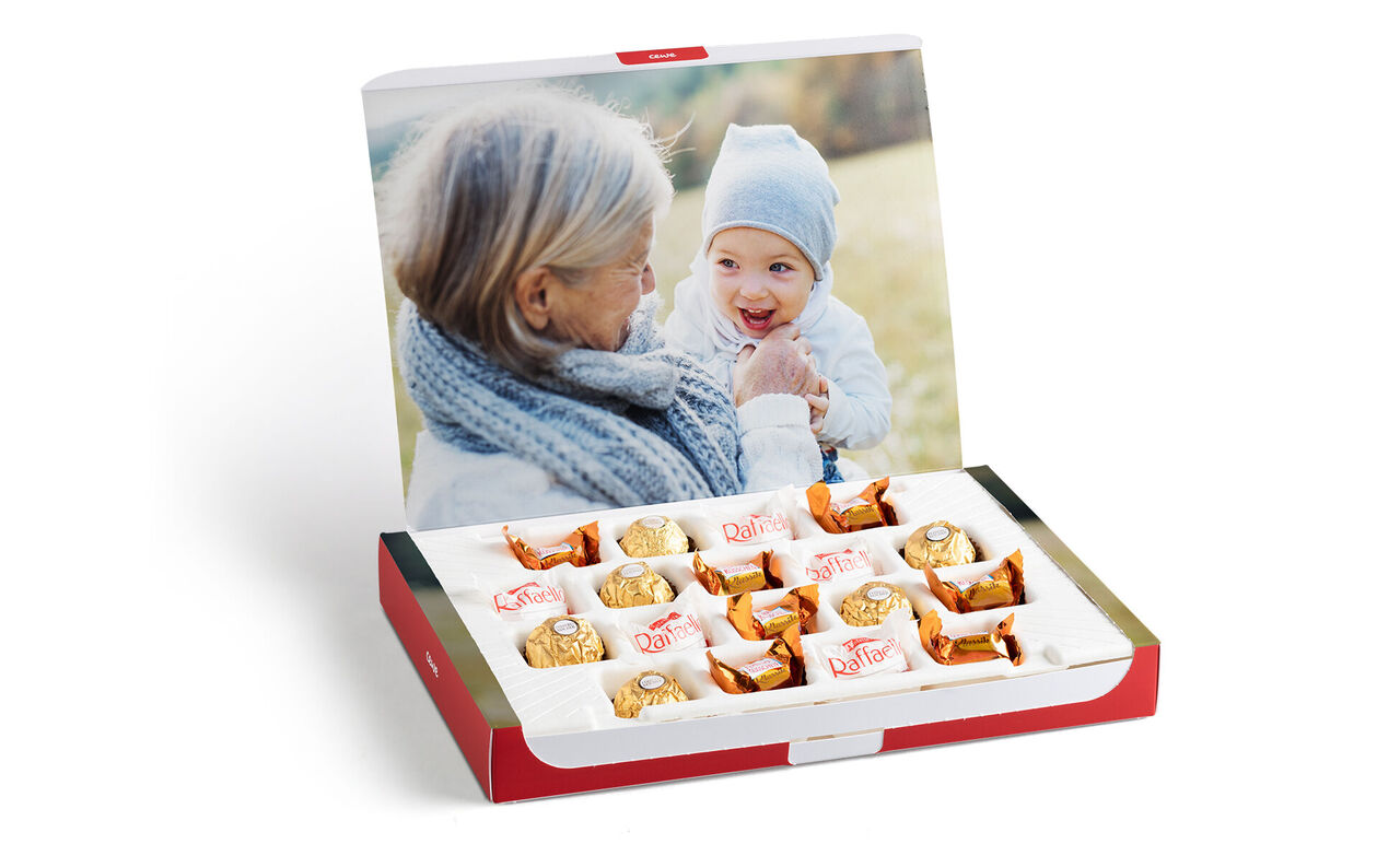 Box of chocolate pralines with a loving photo