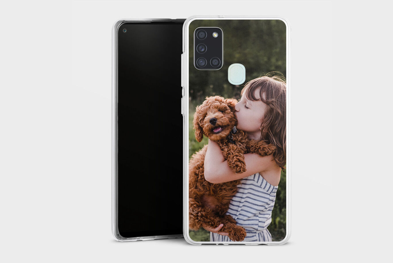 A child hugs a brown dog against a blurred background