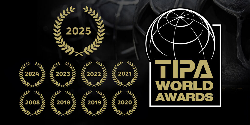 Symbolic award for the TIPA World Awards 2025 with golden laurel wreaths.