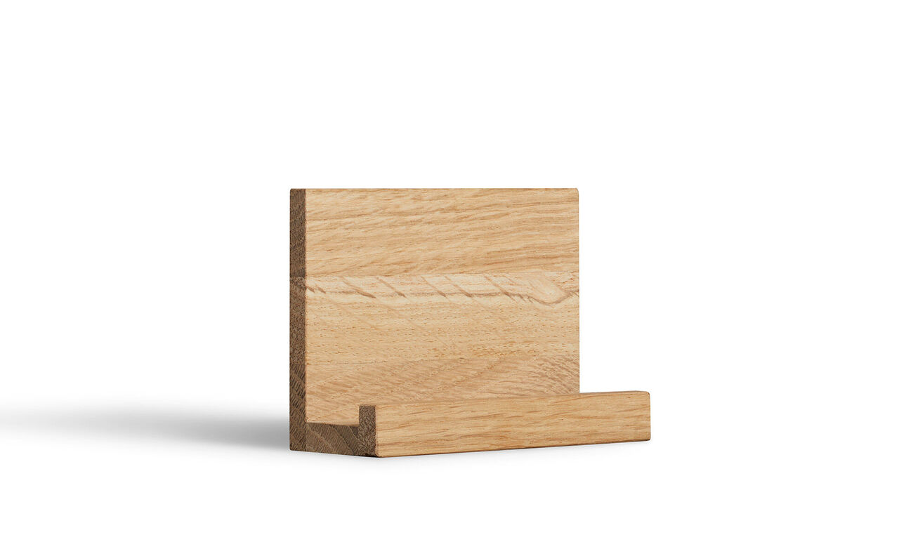 A simple, elegant oak stand, ideal for photos or small works of art.