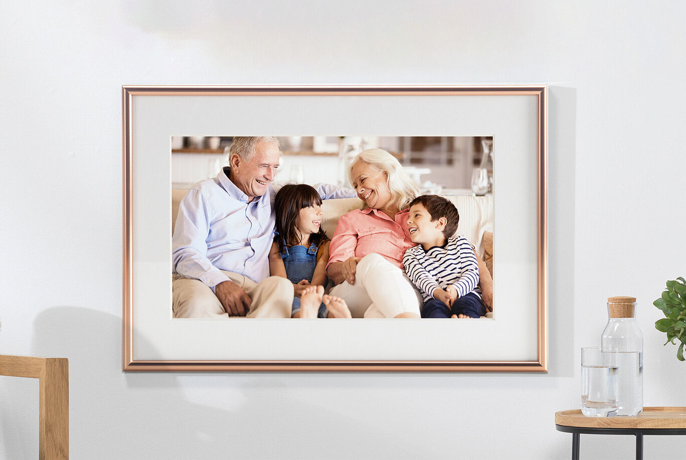 A happy family sits on a couch enjoying time together, surrounded by warmth and love.