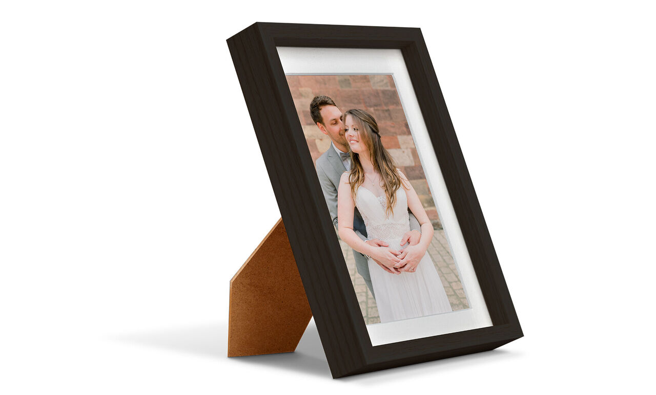 A beautiful framed photo of a couple in a loving embrace, radiating happiness and affection.