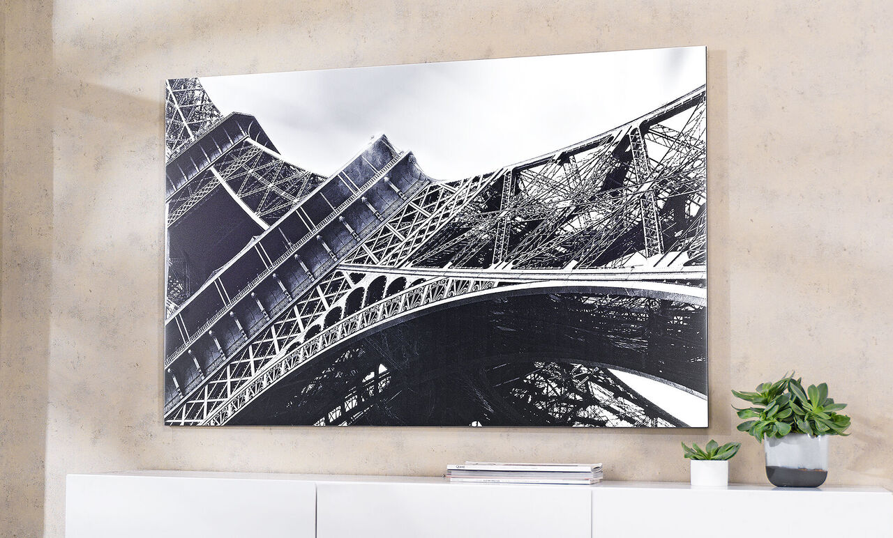 Black and white photo of the Eiffel Tower in Paris, view from below on the structure