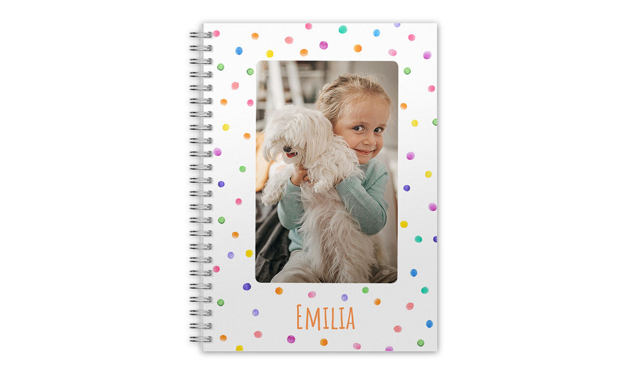Person with a dog on a colorful notebook.
