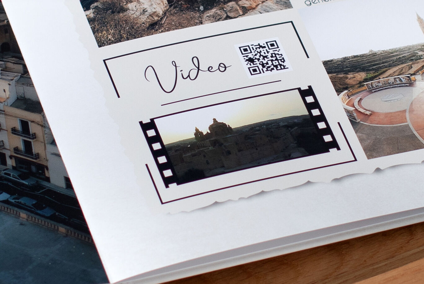 A CEWE photo book shows a video with a QR code.