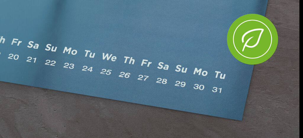 A calendar page with blue background and large numbers for the days.