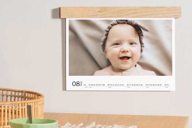 A beautiful photo calendar featuring a charming image of a child presented lovingly in a pleasant room.