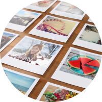 Close-up of colorful photos on a table, capturing memories