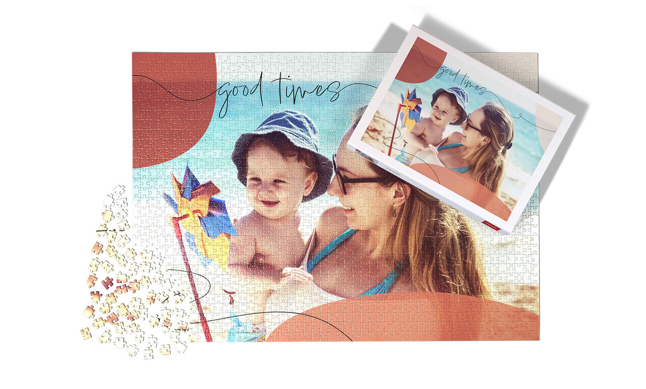A happy couple enjoys a beautiful day at the beach with a colorful pinwheel, surrounded by a creative photo theme.