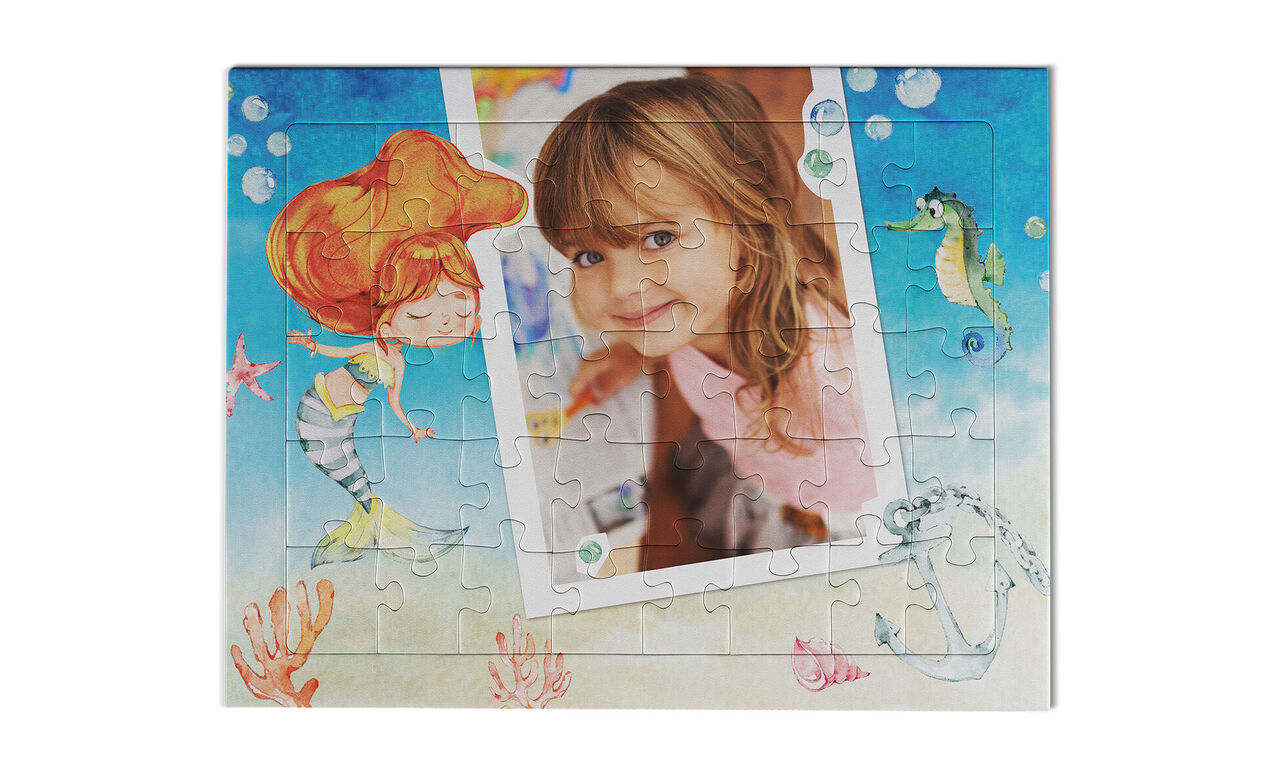 Colorful puzzle with mermaid motifs and a blank photo cutout.