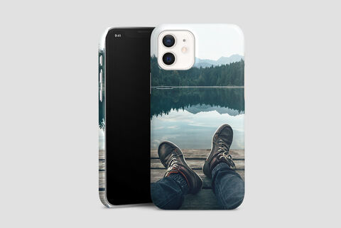 Phone case with mountain lake motif and feet in hiking boots
