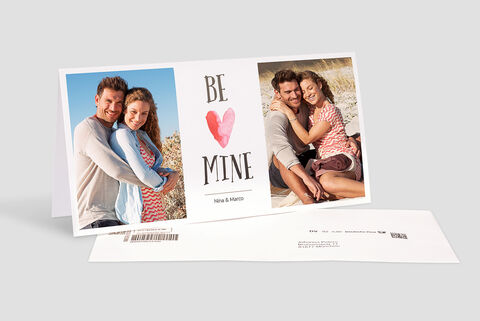 Two people embrace against a beach background. A card reads 'BE MINE'.