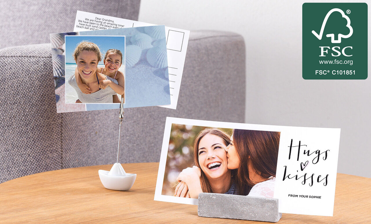 Two lovingly designed photo cards on a table, one shows a couple, the other with 'Hugs & Kisses'.