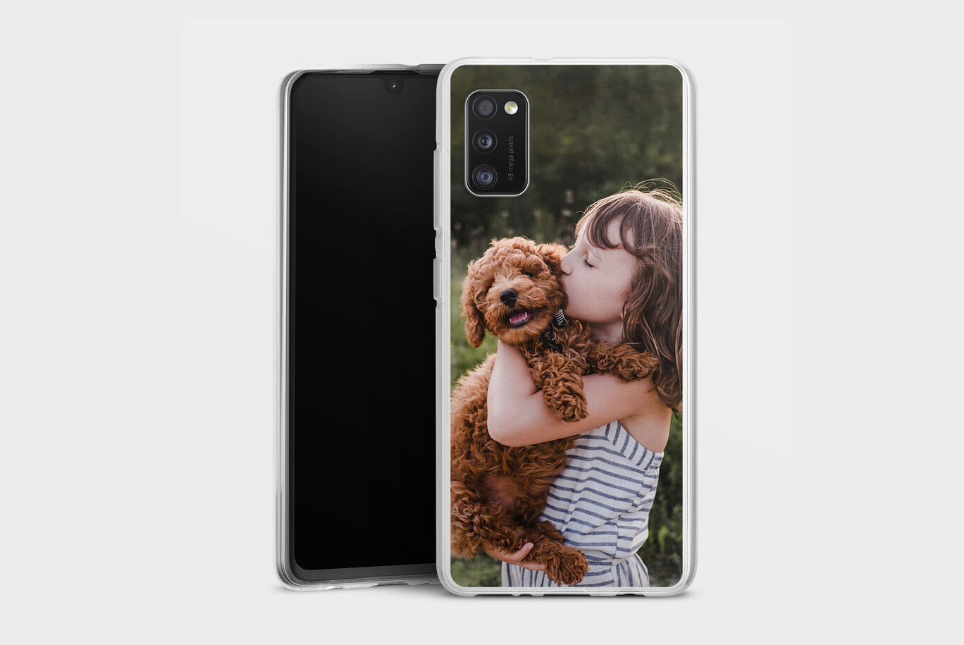 A girl hugs a sweet dog outdoors.