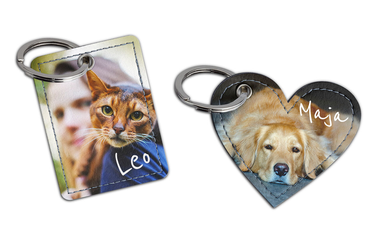 Two personalized keychains in the shape of a rectangle and a heart with cute animal motifs