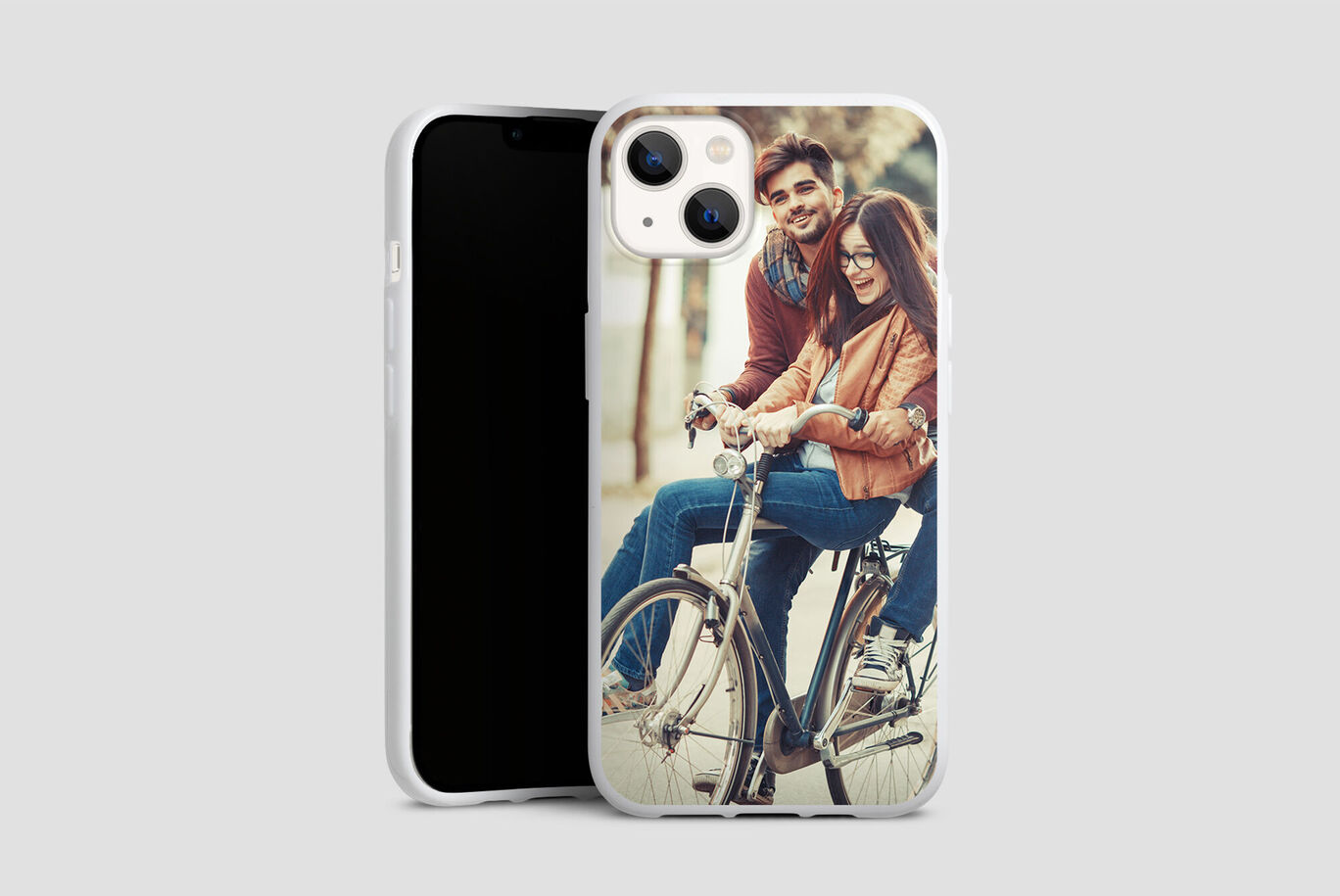 A couple rides a bicycle together and enjoys the moment.