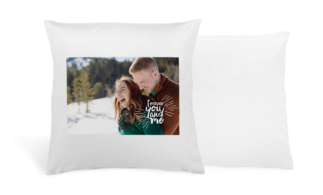 A loving couple in the snow with creative text design.