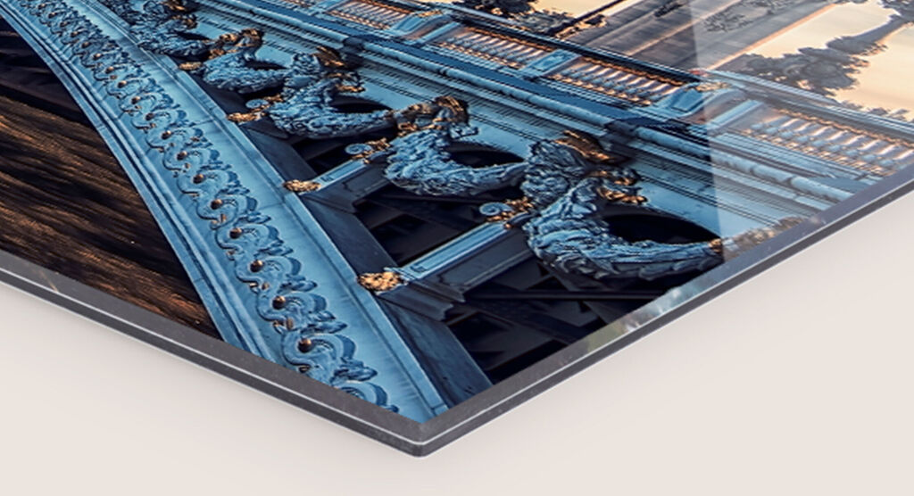Close-up view of an artistic wall art with richly decorated elements glowing in warm colors