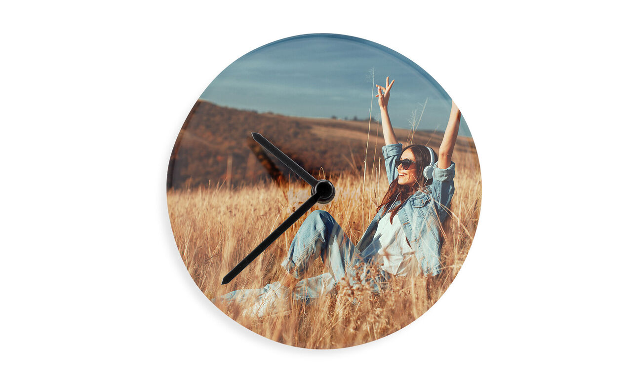 Beautiful wall clock with a joyful person in a golden field, relaxing in a moment of joy.