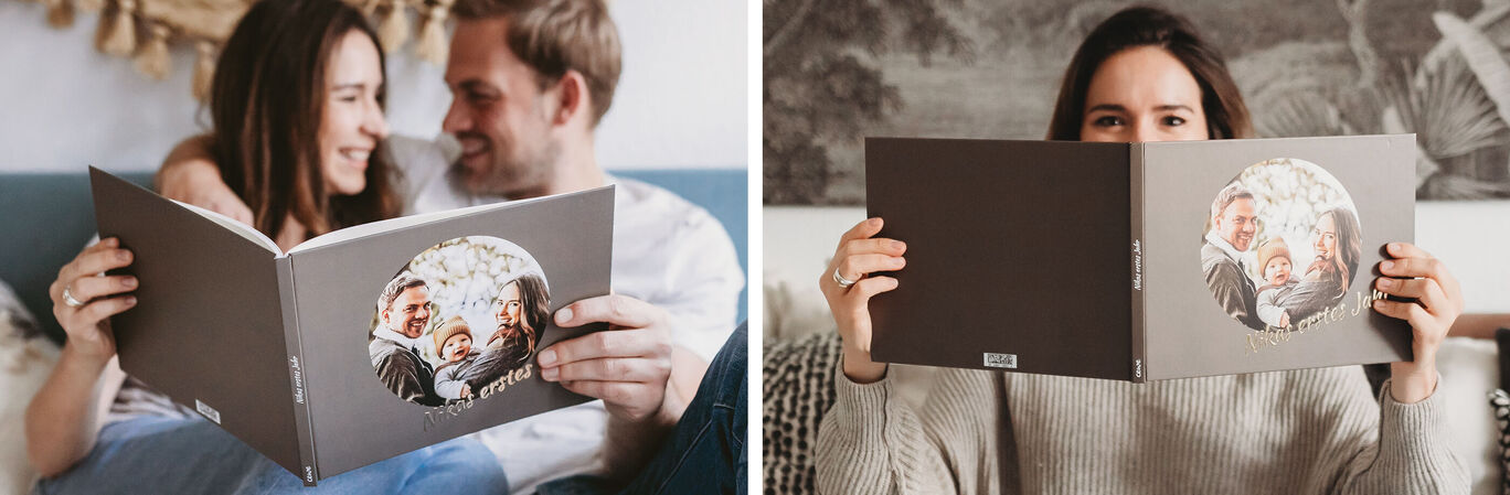 Two people are looking at a photo book with family pictures together.
