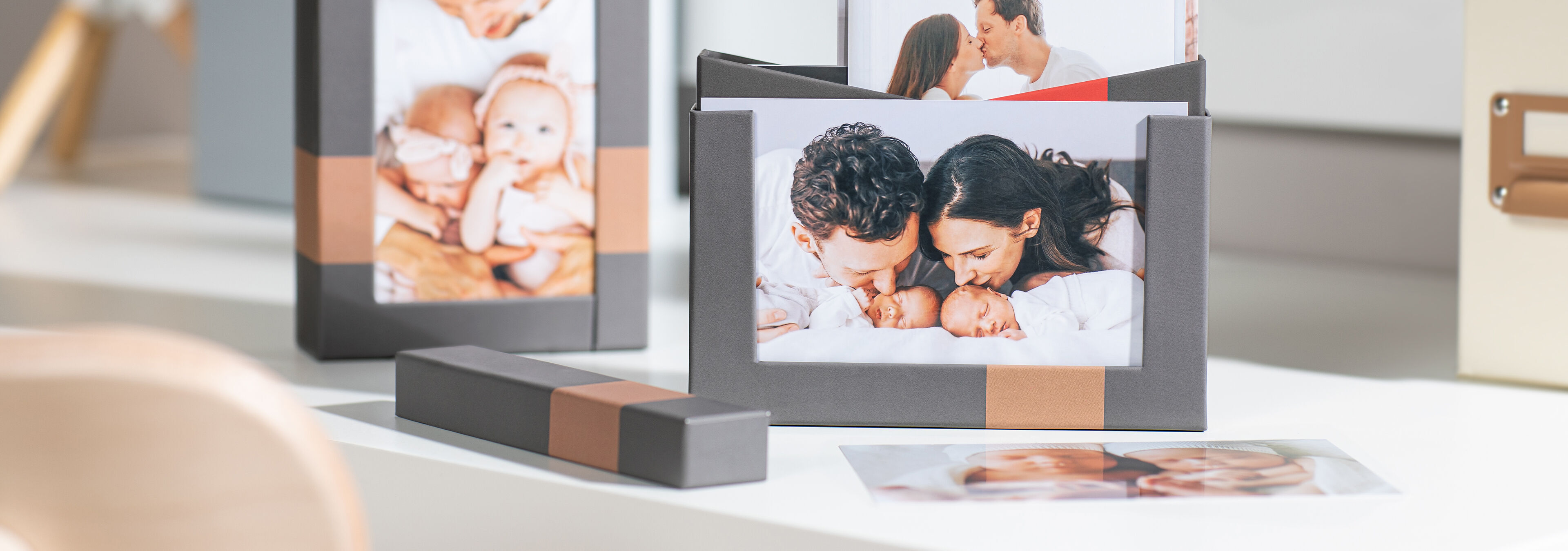 Family pictures in beautiful frames on a table