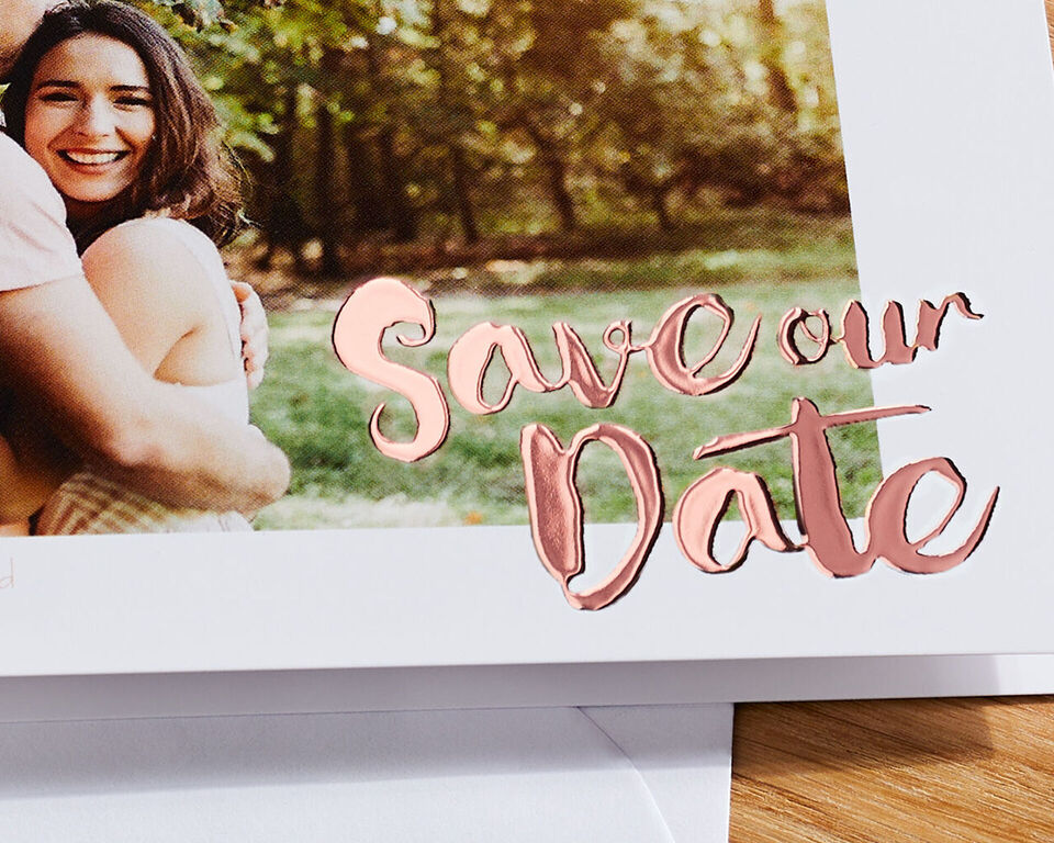 A romantic Save-the-Date card with rose motif.