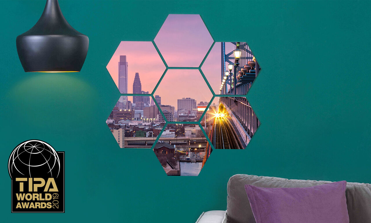 Hexagonal wall decoration with photos, including a trophy.