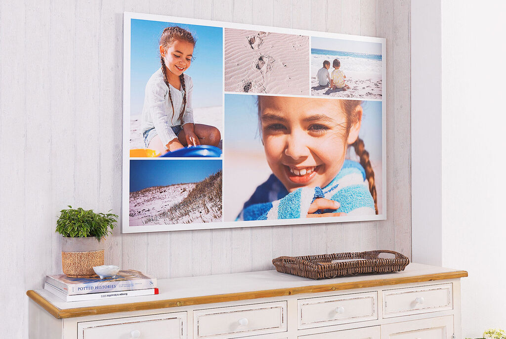 A wall picture with several snapshots from family outings at the beach
