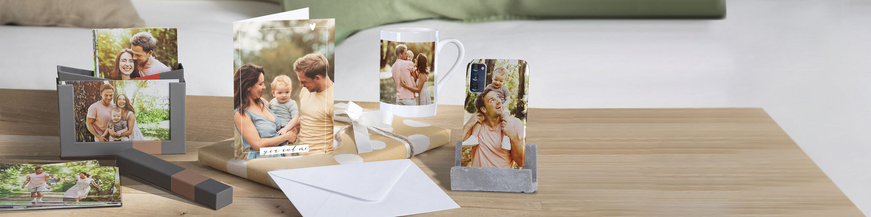 A lovely set of CEWE products, including greeting cards, mugs, and photo mugs, displaying personal memories.