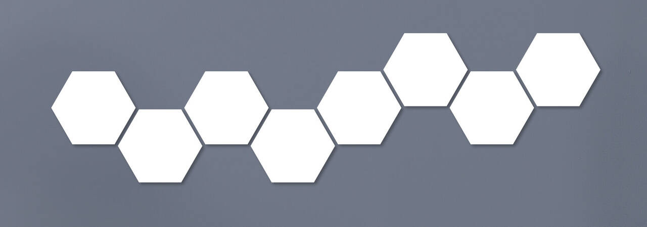 Six colored hexagonal shapes in a line on gray background