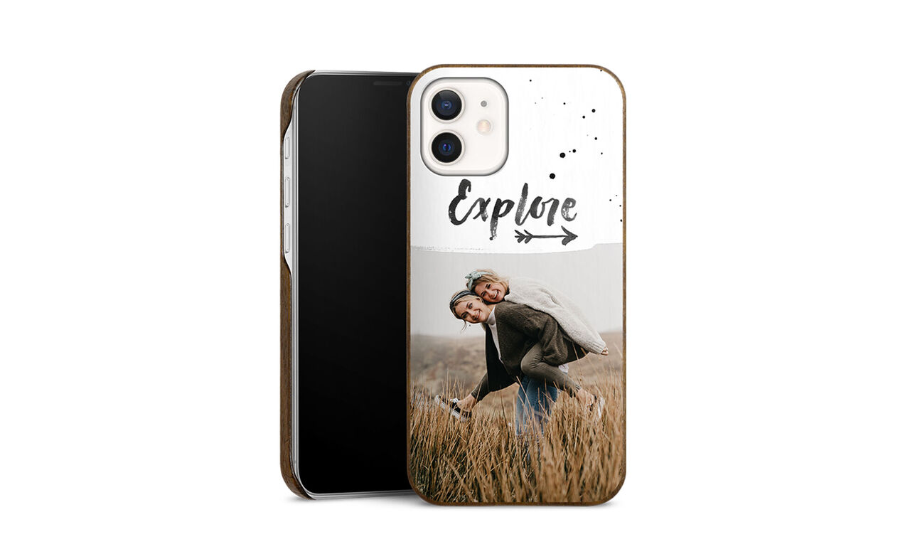 A man carries a woman on his back. They laugh and enjoy the moment in a field.