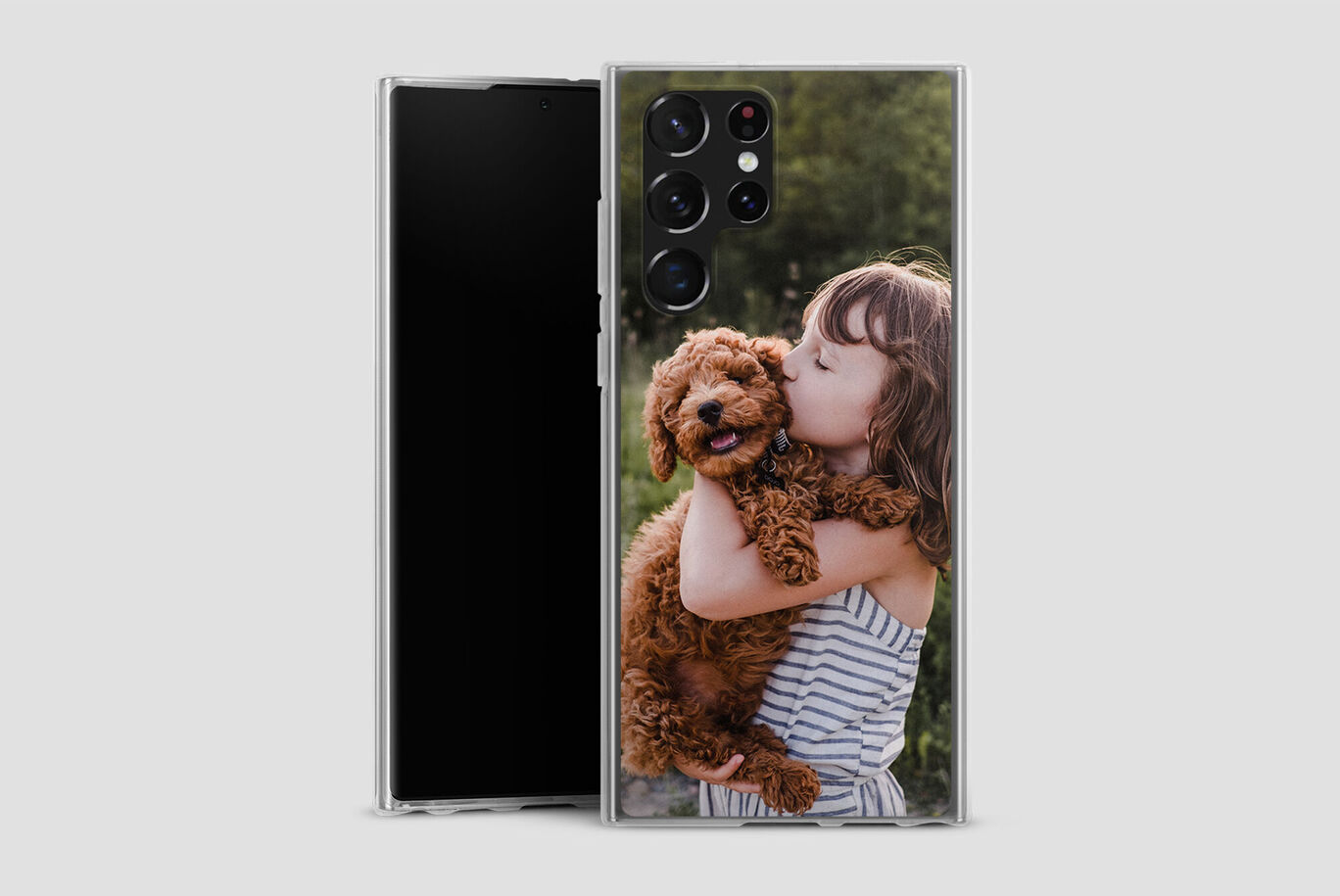 A child hugging a happy dog outdoors