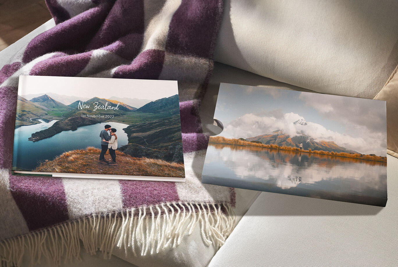 A couple embraces in front of a picturesque mountain landscape in New Zealand, photo book, couples.