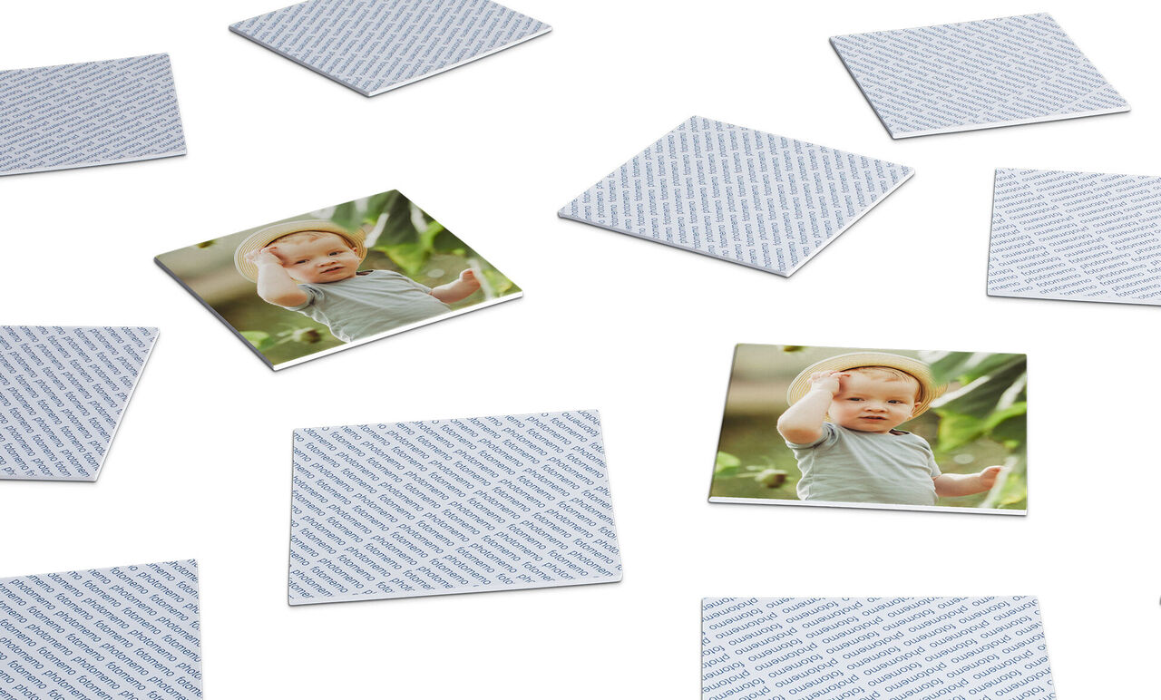 Several cards are on a tabletop, including an image card with a child.