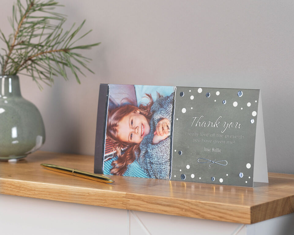 A beautifully designed thank-you card with a smiling young woman and an elegant design.